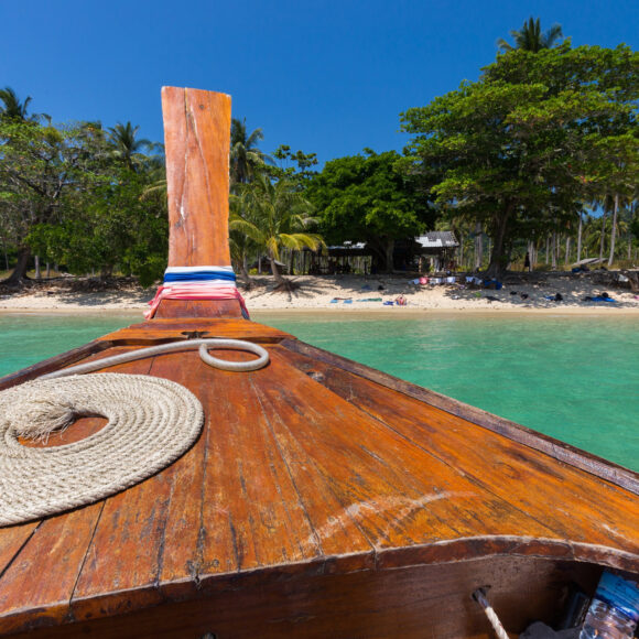 Thai boat on idyllic beach