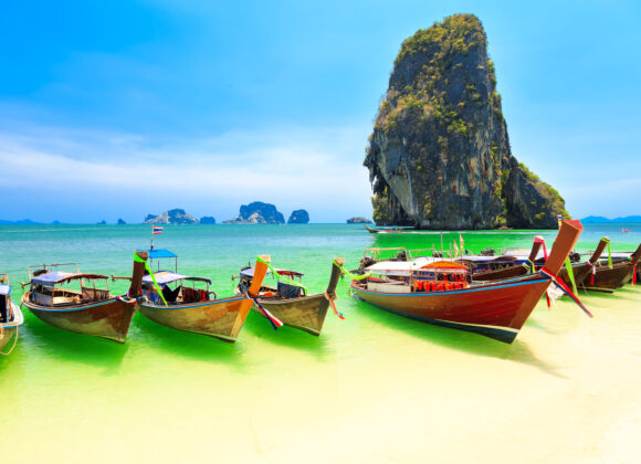 43273434 - few longboats at railay beach, krabi, thailand