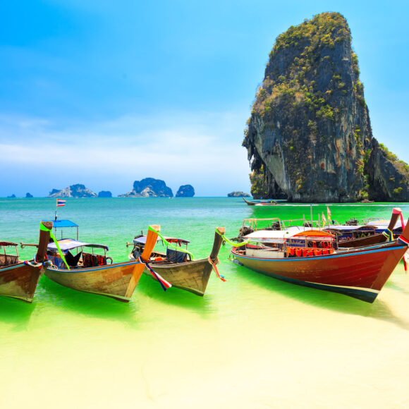 43273434 - few longboats at railay beach, krabi, thailand