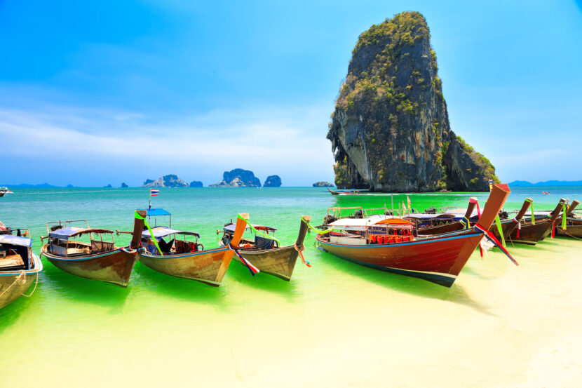 43273434 - few longboats at railay beach, krabi, thailand